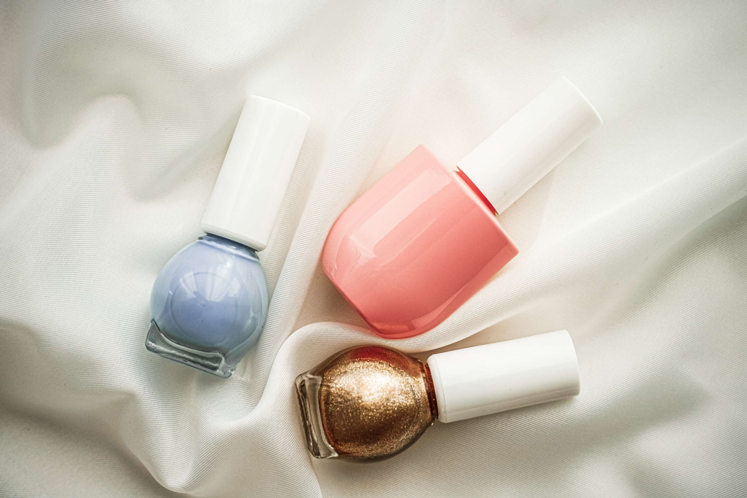 Nail Polish Bottles on Silk Background, French Manicure Products and Nailpolish Make-up Cosmetics for Luxury Beauty Brand and Holiday Flatlay Art Design